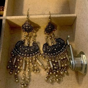 Long silver in color earrings